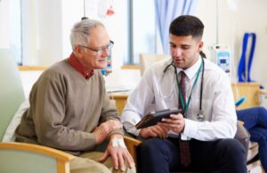 Doctor Talking to Older Man About Healthcare