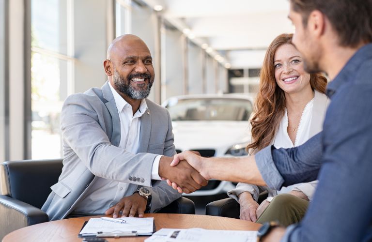 Man Shaking Hands with a Car Dealer