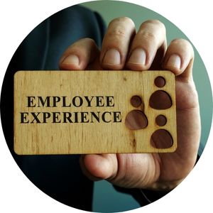 Person Holding Wood Plaque with Employee Experience Text