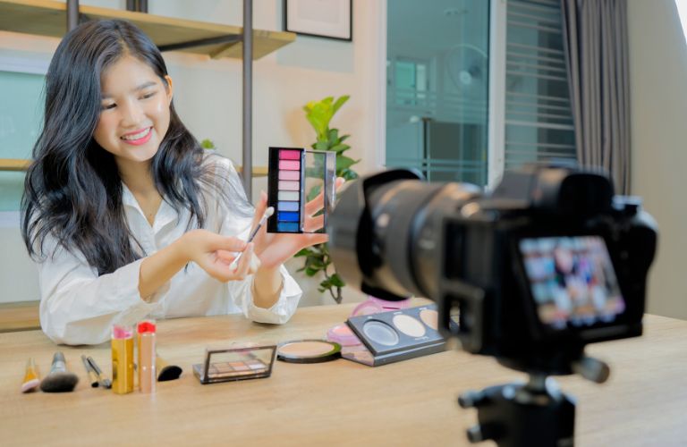 Woman Showing Makeup on Camera for E-Commerce