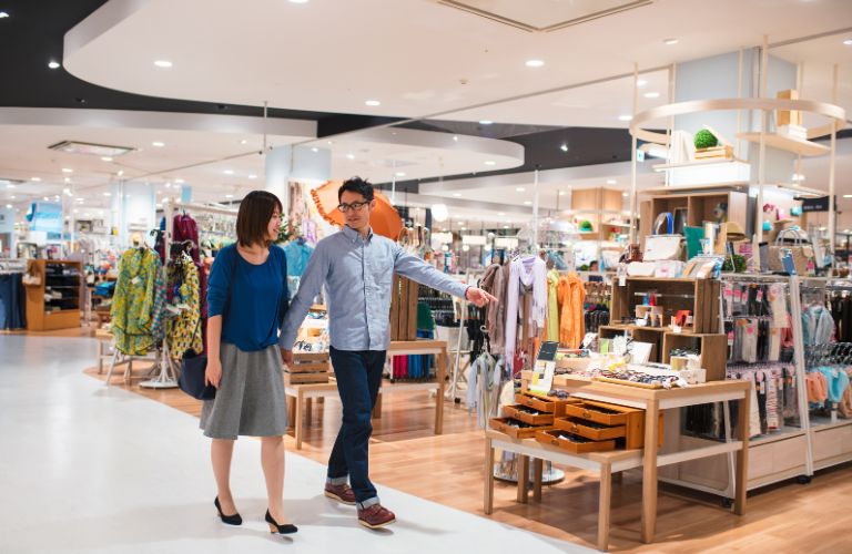Man and Woman Shopping in a Department Store