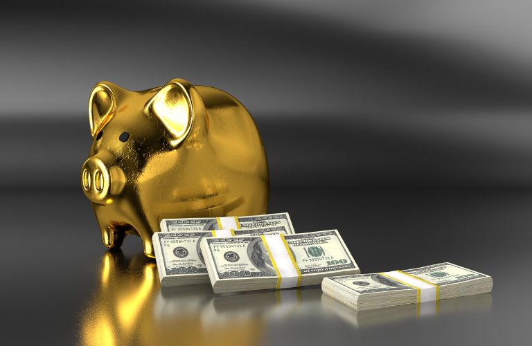 Golden Piggy Bank with Stacks of Cash