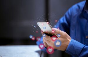 Person Using Social Media on a Smartphone with Hearts and Likes