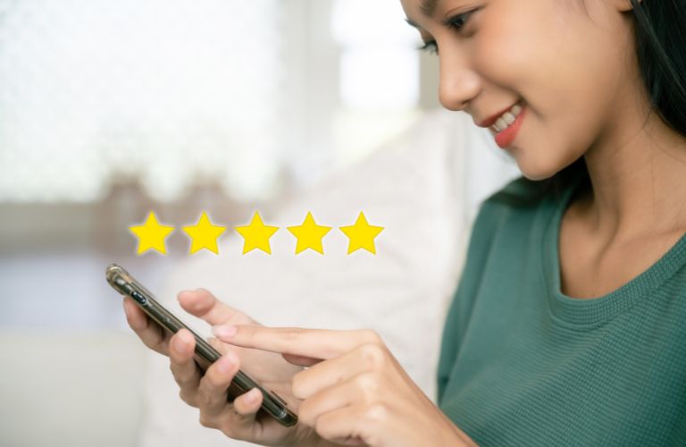 Woman with Smartphone and 5-Star Graphic