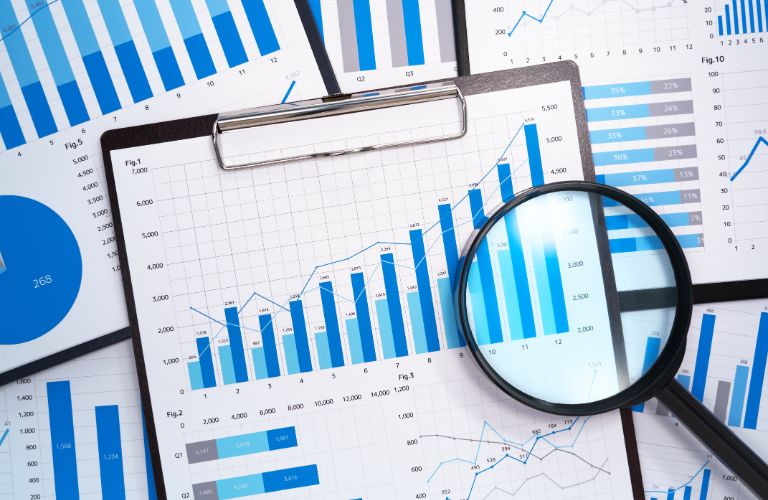 Bar Graphs and Documents with Magnifying Glass